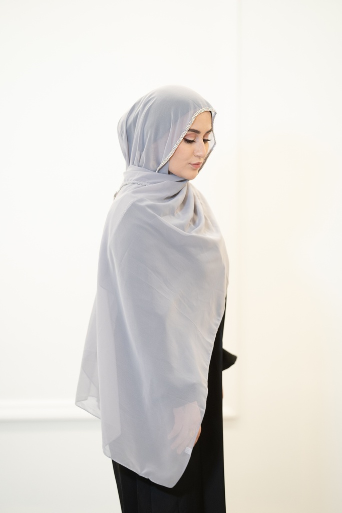 A sky blue georgette shawl with silver beads along the entire length of the shawl.