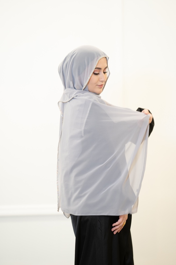 A sky blue georgette shawl with silver beads along the entire length of the shawl.