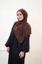 A brown cotton shawl with shiny gold beads throughout the entire shawl. 